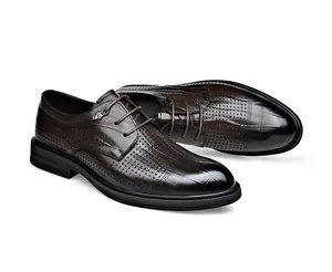 Professional close-up of brown perforated leather dress shoes showing breathable texture