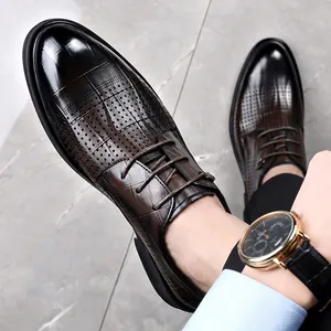 Elegant men's brown gradient leather dress shoes with breathable perforated lace-up design.