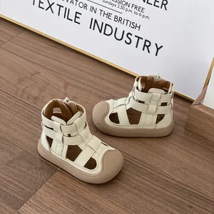 Cream colored girls' closed-toe Roman sandals with soft rubber soles for toddlers