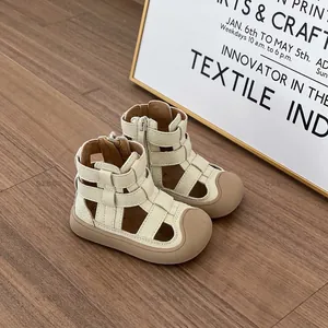 Toddler girls' closed-toe Roman sandals with soft soles in cream beige color finish.