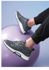 Stylish grey breathable mesh height increasing sports running shoes for men shown on model