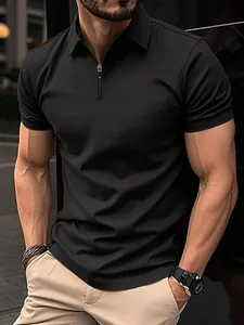 Men's athletic fit black polo shirt with quarter-zip collar in urban outdoor setting