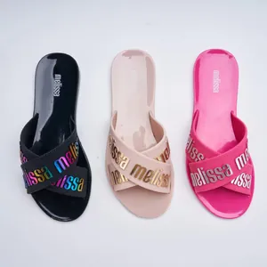 Melissa signature jelly cross-strap slide sandals in black, nude, and hot pink colors