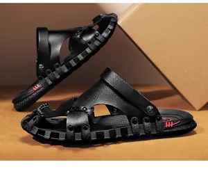 Side view detail of black men's leather sandals with non-slip sole and cutout design.