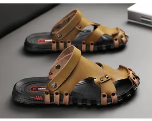Close-up of men's brown leather sandals with dual-use straps and anti-slip soles
