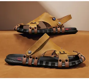 Close-up of men's brown leather sandals featuring adjustable heel straps and thick soles