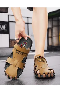 Macro view showing the texture of men's brown leather sandals and rugged soles.