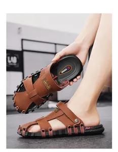 Detailed view of men's brown leather sandals featuring non-slip soles and MLB branding