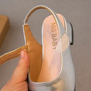 Elegant silver closed-toe girl's sandal with MG BABY logo detail for spring and summer