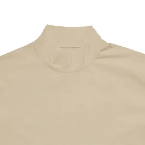 Close-up detail of a men's beige mock neck t-shirt collar featuring precise stitching.