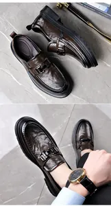 Detailed view of dark brown perforated leather loafers showing breathable texture and buckle