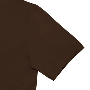 Macro detail view of the shoulder and sleeve stitching on dark brown men's T-shirt