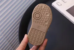 Close-up detail shot of the durable non-slip rubber sole for toddler walking shoes