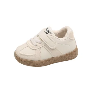 Stylish cream white toddler sneakers with velcro straps and durable non-slip rubber soles