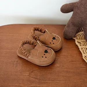 Adorable brown baby sandals with cute bear face design and flexible soft sole for toddlers