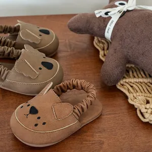 Cute brown toddler sandals featuring cartoon dog faces and comfortable soft elastic straps
