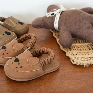 Soft sole baby walking sandals with cute bear face design in brown faux suede