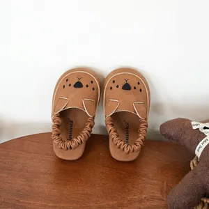 Adorable brown baby walking shoes with cute cartoon bear face and soft flexible sole