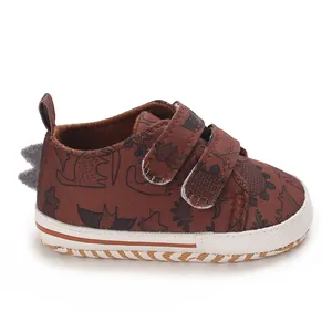 Side view of brown dinosaur print baby walking shoe with velcro straps