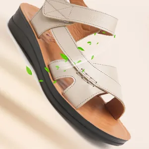 Breathable cowhide leather flat sandals for elderly women with hook and loop strap