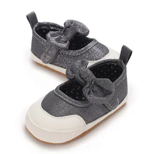 Grey denim baby walking shoes with bow and soft white toe cap for infants