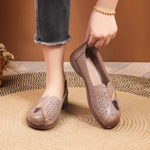 Comfortable brown leather flat shoes for elderly women with breathable cutout flower patterns