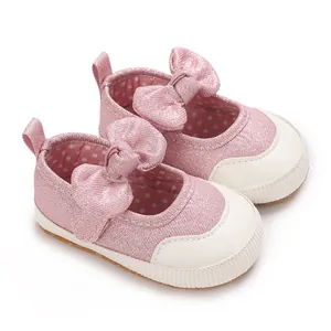 Sparkly pink baby girl walking shoes with large bows and comfortable soft soles