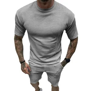 Zomers grijze wafelgebreide herenset met t-shirt en korte sportbroek voor mannen