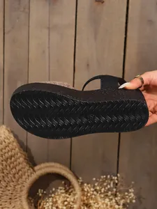 Close-up of the anti-slip wavy textured sole on trendy women's platform wedge sandals