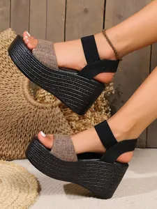 Detail view of stylish summer platform wedge sandals with woven texture