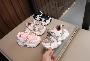 Detailed view of breathable mesh kids' sneakers in various colors including pink and khaki.