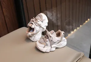 Breathable mesh children's sneakers in beige and brown with thick soles and velcro