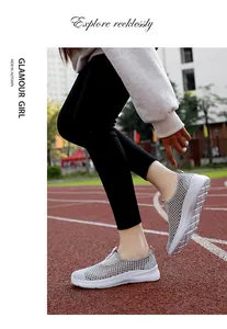 Close-up view of breathable grey mesh slip-on walking shoes for women on a track