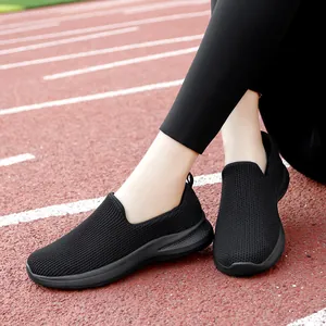 Breathable black flyweave slip-on walking shoes with soft cushioning soles for women.