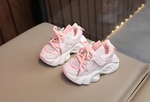 Detailed side view of pink and white breathable mesh sneakers for toddler girls and boys