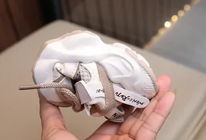 Close-up of flexible breathable mesh toddler sneaker showing soft sole bendability