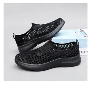 Detailed side view of women's breathable black mesh slip-on casual walking shoes