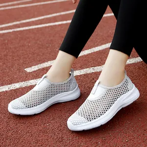Breathable women's grey mesh slip-on sneakers for casual outdoor sports activities