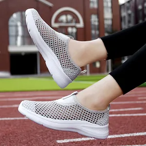 Breathable women's mesh slip-on sneakers with soft white soles for summer casual wear