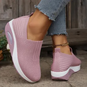 Close-up detail of pink breathable flying woven rocker shoes with air cushion white sole.