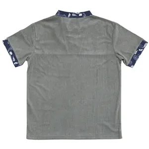 Back view of men's loose corduroy shirt with paisley patterned collar and cuffs