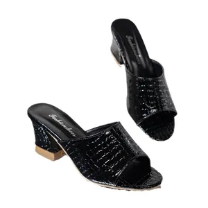 Fashionable women's black snake-patterned chunky heel mules featuring an open peep toe design