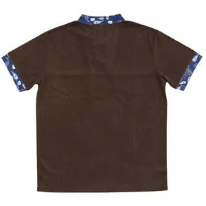 Back view of brown corduroy short sleeve shirt with blue paisley accents on collar and cuffs