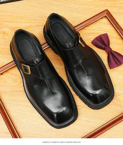 Detailed view of genuine leather black monk strap men's shoes with gold buckle