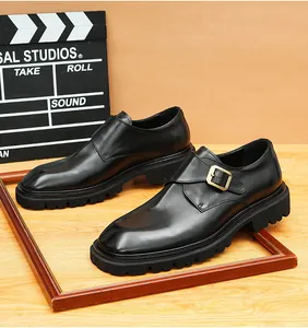 Close-up detail of premium black leather monk strap shoes featuring a thick rugged lug sole