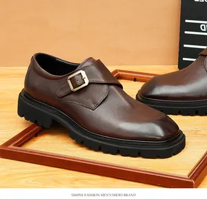 Detail view of brown leather monk strap shoe with thick lug sole and buckle