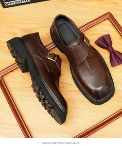 Detailed view of dark brown leather monk strap shoes for men on a wooden background