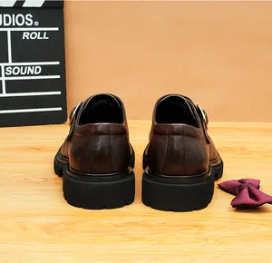 Rear view of men's dark brown leather monk strap shoes with stylish thick lug soles