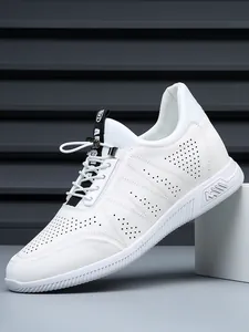 Detail view of men's white breathable genuine leather sneakers with hollow design