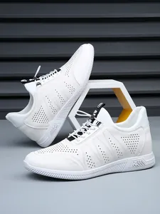 Close-up of men's white perforated leather sneakers with hidden heightening soles